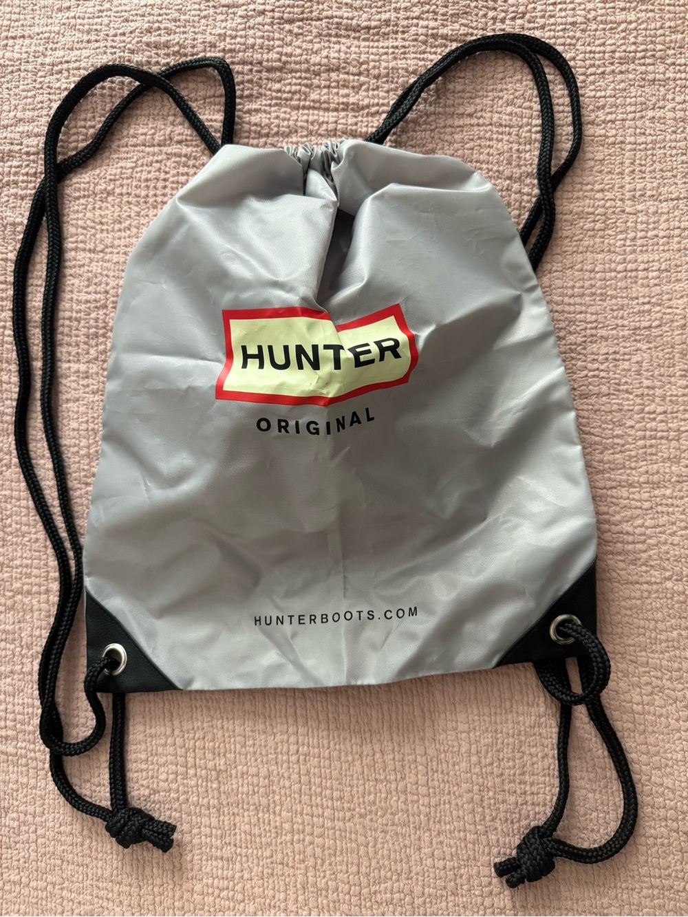 Hunter Light Gray Drawstring Backpack with Red and White Logo